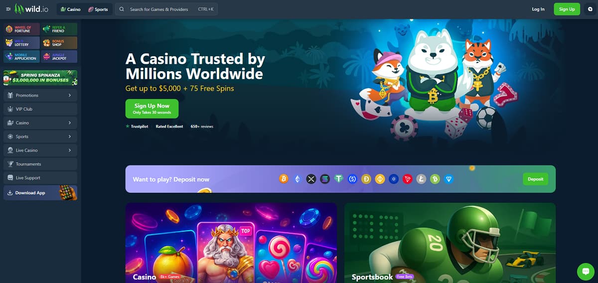 Wild.io inicio con banner que ofrece hasta 5.000 US$ y 75 giros gratis. Navegación incluye casino, deportes y torneos, con diseño oscuro y mascotas animales rodeadas de fichas y cartas.